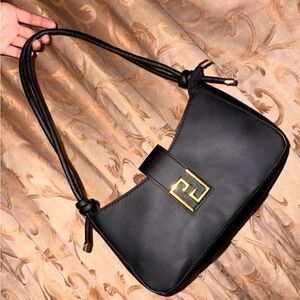 Small black adjustable shoulder purse